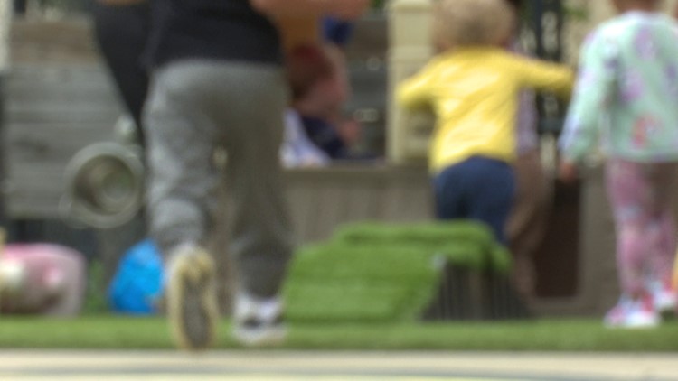 A mother and child playing together in a park